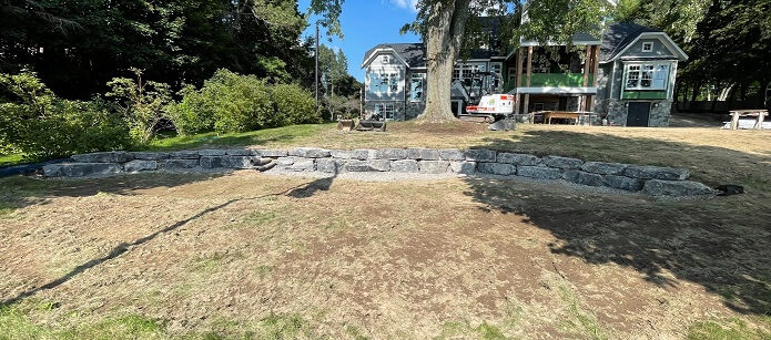 Excavation & Grading with retaining wall in backyard